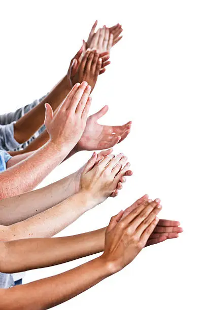 Many mixed hands held out to the side, clapping enthusiastically. Isolated on white.  