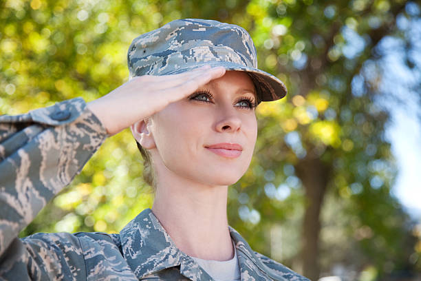 US Air Force Series: American Airwoman Outdoor Portrait of a female US airwoman in airman battle uniform or ABU outdoor in autumn. us air force photos stock pictures, royalty-free photos & images