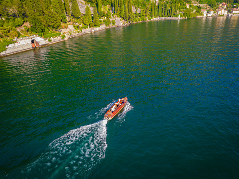 Aerial view of classic old wooden luxury sailing boat in Lake Como