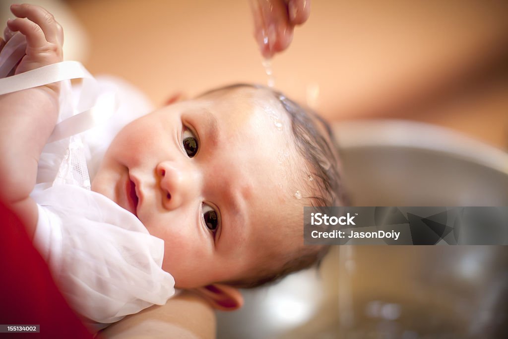 Baptism: Baby Boy A 6 month old baby boy is baptized in a Catholic Church. Baptism Stock Photo