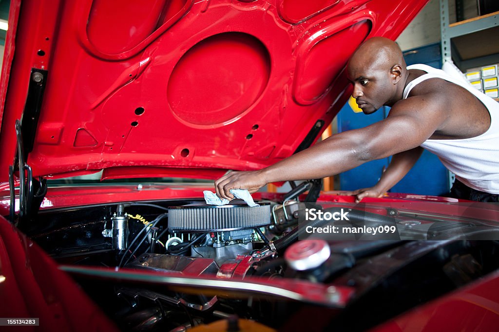 car lover cleaning his vintage muscle automobile Mechanic Stock Photo