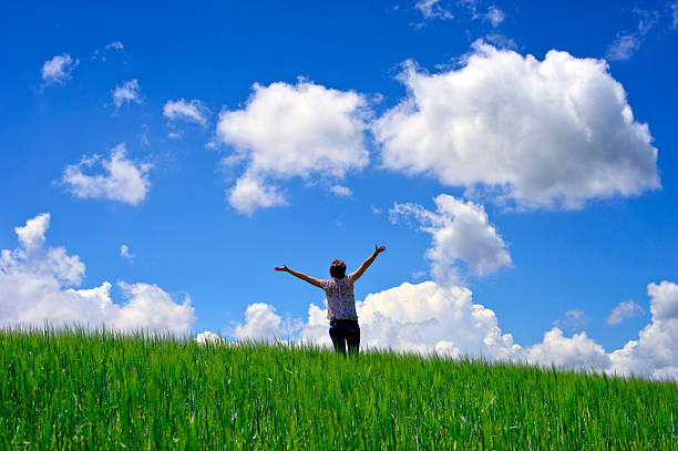 istock Happy young woman rest on wheat field 155134480