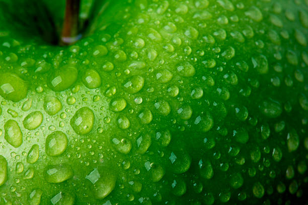 Green Apple Detail Waterdrop on Green Apple.  condensation photos stock pictures, royalty-free photos & images