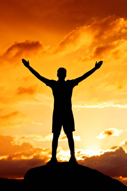 istock Young man with outstretched arms, sunset scenery after storm (I) 155134564