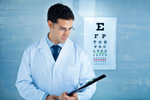 istock Optician in front of an eye chart 155135374