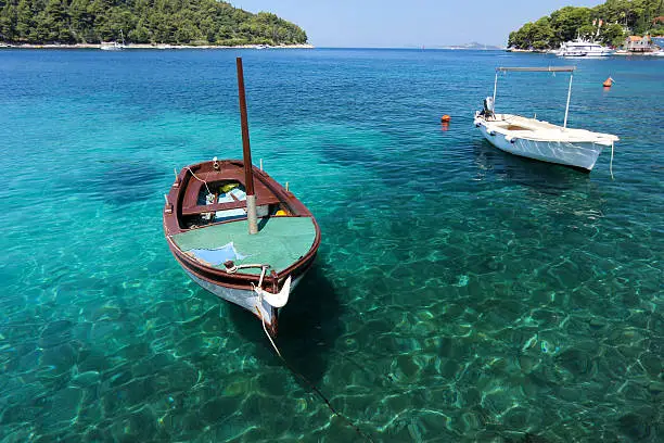 A boat in the scenic harbour of Cavtat near Dubrovnik on the Dalmatian coastline