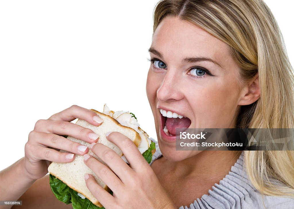 Donna mangiare un panino - Foto stock royalty-free di 20-24 anni