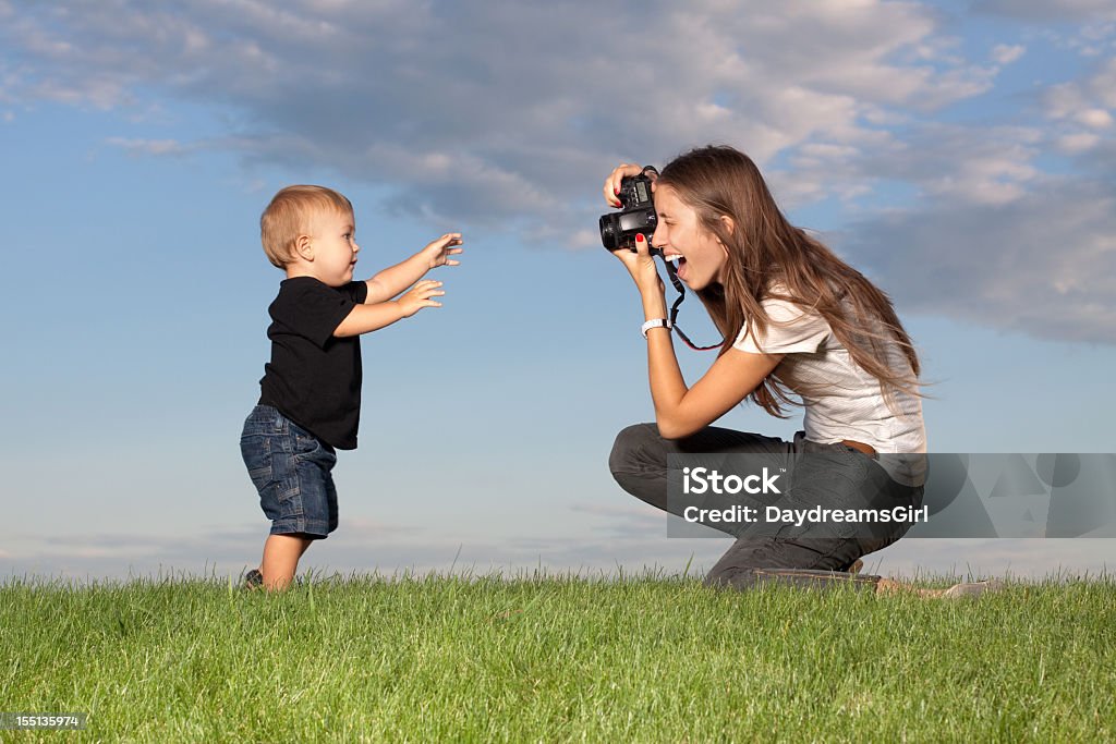 Mother taking pictures of walking child outdoors Young mother with camera, taking a picture of her toddler child.
[url=file_closeup.php?id=17322615][img]file_thumbview_approve.php?size=1&id=17322615[/img][/url] [url=file_closeup.php?id=17322384][img]file_thumbview_approve.php?size=1&id=17322384[/img][/url] [url=file_closeup.php?id=17311325][img]file_thumbview_approve.php?size=1&id=17311325[/img][/url] [url=file_closeup.php?id=17310747][img]file_thumbview_approve.php?size=1&id=17310747[/img][/url] [url=file_closeup.php?id=17310211][img]file_thumbview_approve.php?size=1&id=17310211[/img][/url] [url=file_closeup.php?id=17287309][img]file_thumbview_approve.php?size=1&id=17287309[/img][/url] [url=file_closeup.php?id=17287119][img]file_thumbview_approve.php?size=1&id=17287119[/img][/url]

[url=http://www.istockphoto.com/search/lightbox/3693474/#1417478]PHOTOGRAPHY[/url]
[url=http://www.istockphoto.com/search/lightbox/3693474/#1417478][img]http://www.micro-stock-photos.daydreamsgirl.com/stockimagelinks/photography.jpg[/img][/url]

[url=http://www.istockphoto.com/search/lightbox/2194555/#10e22e7e][img]http://www.micro-stock-photos.daydreamsgirl.com/stockimagelinks/families.jpg[/img][/url]

[url=http://www.istockphoto.com/search/portfolio/1727528/?facets=%7B%2225%22%3A%226%22%7D#1aaf3126][img]http://www.micro-stock-photos.daydreamsgirl.com/stockimagelinks/portfoliobanner.jpg[/img][/url] 12-17 Months Stock Photo