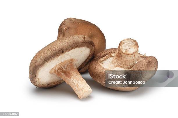 Three Shiitake Mushrooms Isolated On A White Background Stock Photo - Download Image Now