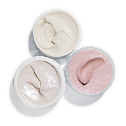 High angle view of 3 opened cream pots (+ clipping path)