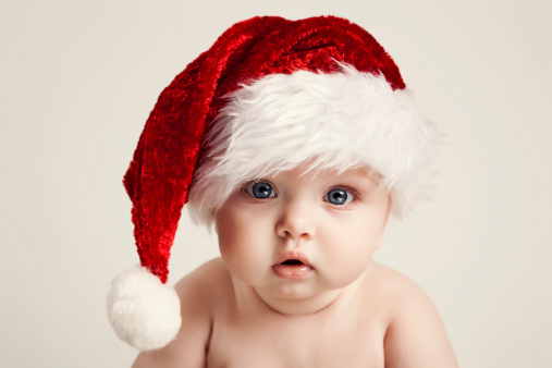 Beautiful baby wearing Santa hat
