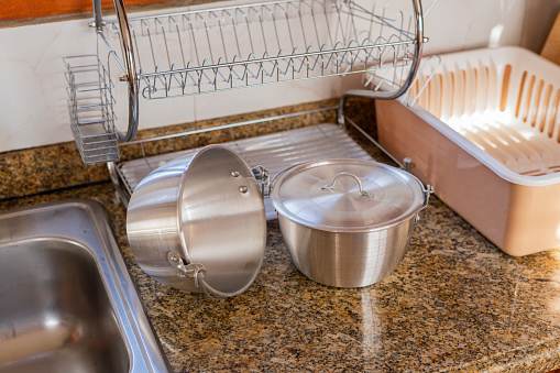 Photography of silver pots in the kitchen of the house