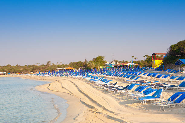 Landa beach Cyprus Landa beach - Ayia Napa town - Cyprus island. Beautiful sandy beach with crystal blue water. cyprus agia napa stock pictures, royalty-free photos & images