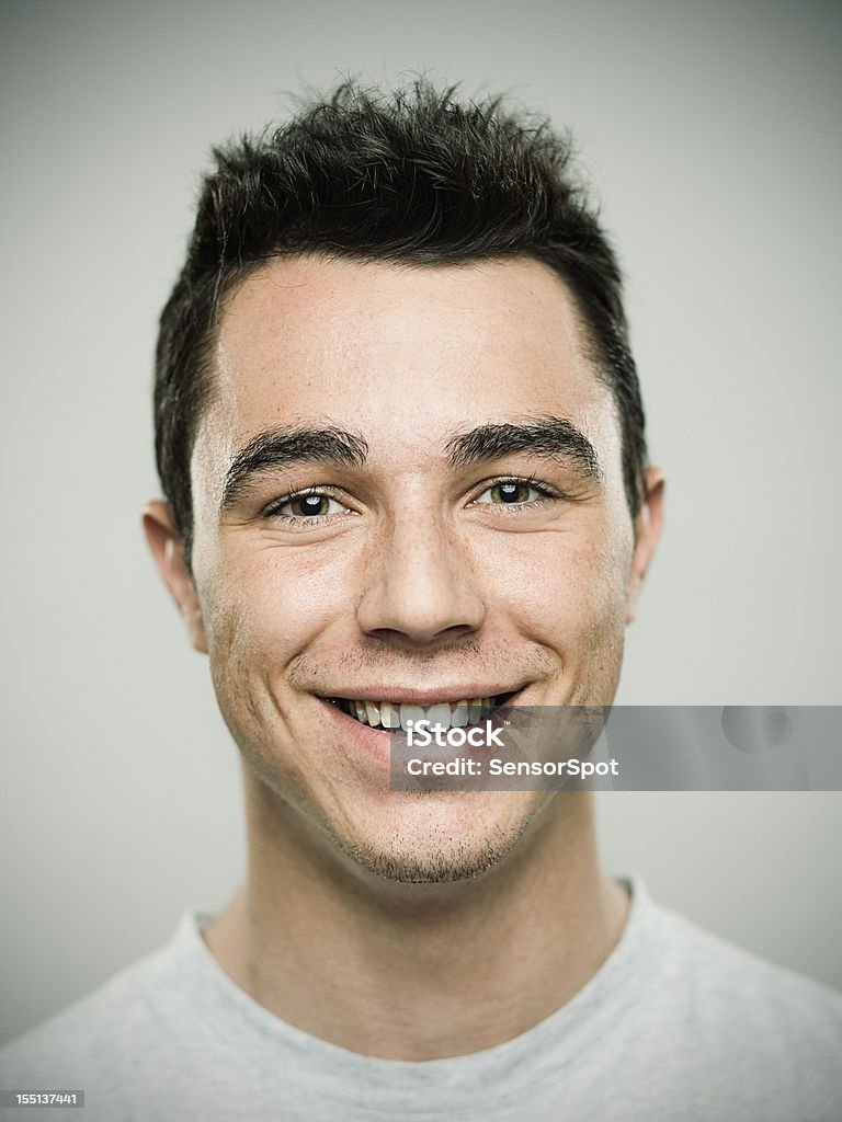 Portrait of Young Man laughing Real young smiling man Short Hair Stock Photo