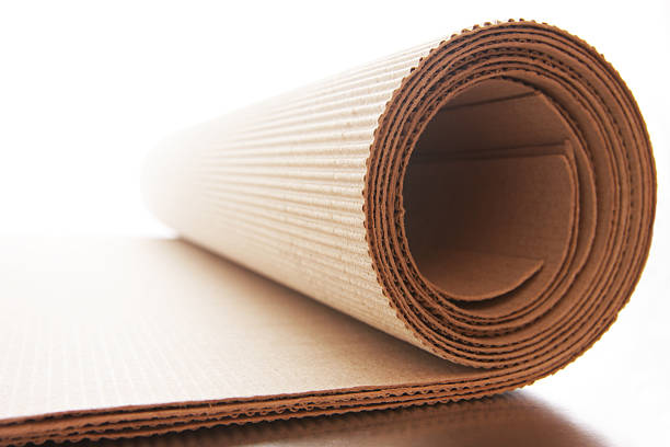 Corrugated cardboard roll on white background stock photo