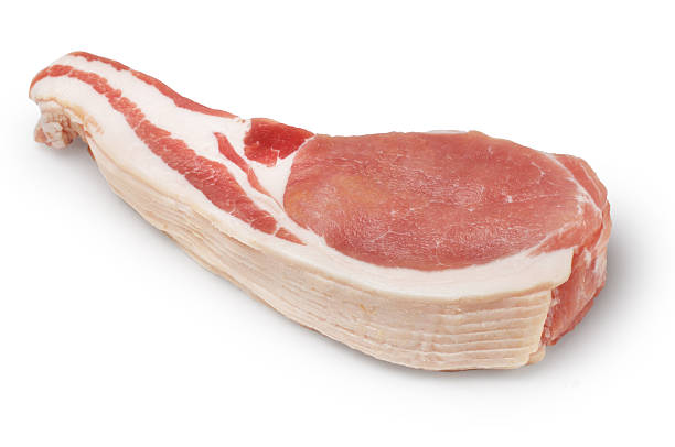 Bacon Pile of bacon slices isolated on white. uncooked bacon stock pictures, royalty-free photos & images