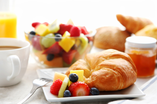breakfast- croissant, fruit salad and coffee