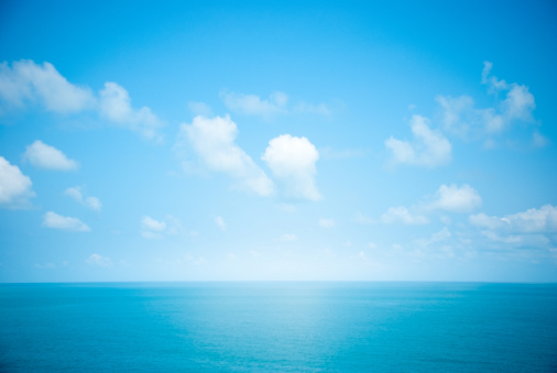 Beautiful seascape of blue sea and sky with white clouds.