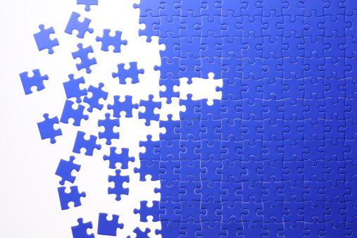 Lots of blue jigsaw puzzle isolated on white background.