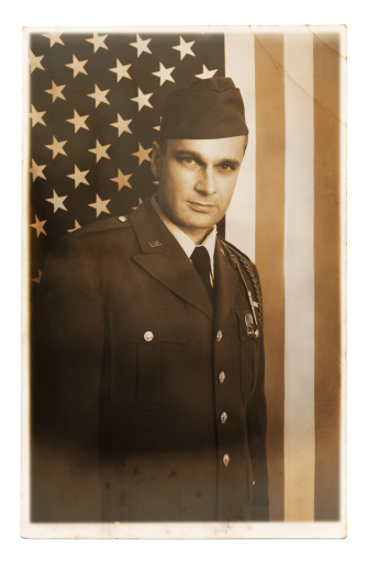 American soldier portrait in front of us flag.