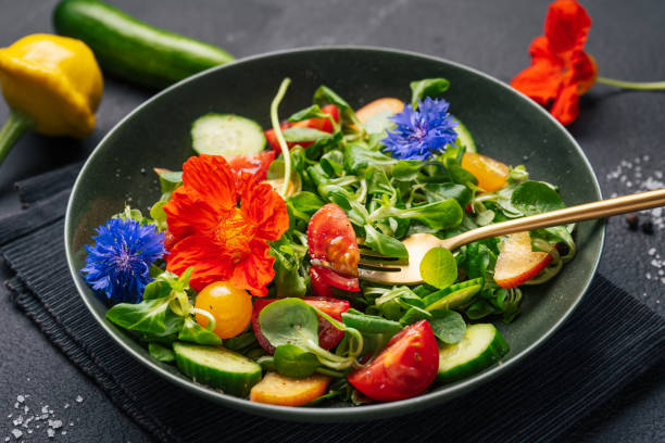 istock Green fresh salad with cucumbers and tomatoes 1551388018