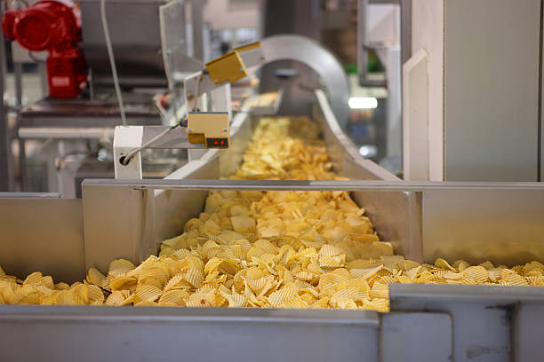 Crisp factory Crisp conveyor potato chip photos stock pictures, royalty-free photos & images