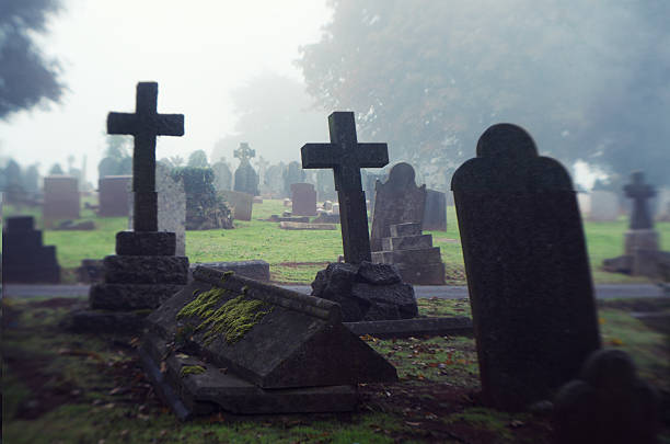 istock Spooky Halloween Misty Cemetery Scene Gravestones 155138949