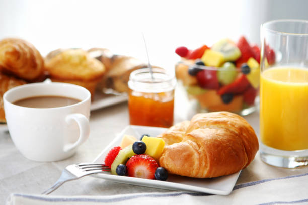 istock breakfast- croissant, fruit salad and coffee 155139087