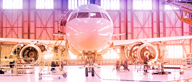 Passenger aircraft on maintenance of engine disassembled engine blades and fuselage repair in airport hangar. Format banner header wide size, place sample text