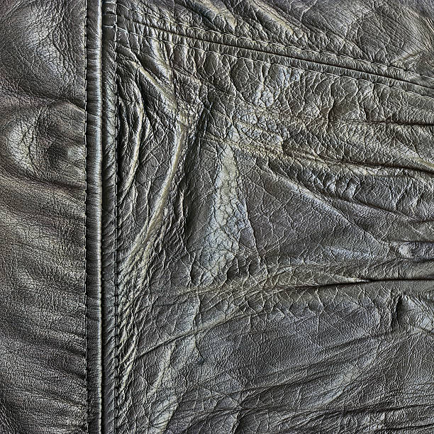 istock Hi-Res Old Black Veal Leather Patchwork Crumpled Wizened Grunge Texture 155139197