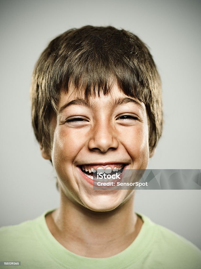 Real happy kid Portrait of a real kid smiling. Teenage Boys Stock Photo