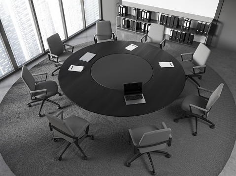 Top view of stylish meeting room with white and gray walls, concrete floor, round conference table with gray chairs and cabinet with folders. 3d rendering