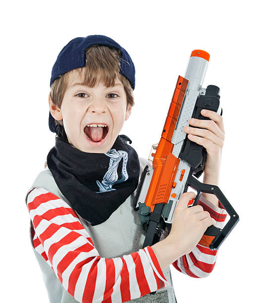 Cтоковое фото Мальчик в качестве солдат с пистолет