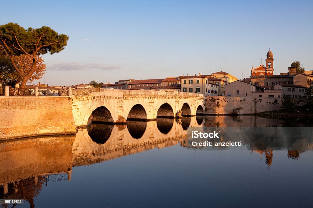 Tiberius bridge in Rimini, Italy this Italian landmark architecture was constructed by the Romans in the 1st century a.C. The five-arched bridge is still in use for the lively traffic in town. Rimini Stock Photo