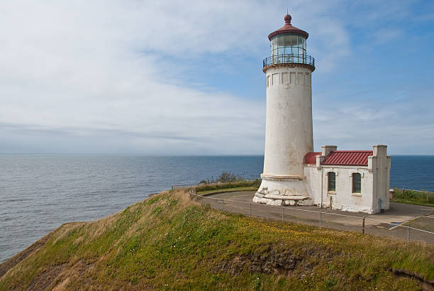 North Head Lighthouse With the advent of radar, GPS and other advanced navigation tools, lighthouses no longer need to perform the same function they once did; guiding ships to safety. Instead, they have been preserved as historic monuments; reminding us of a time when shipping and sailing were more perilous activities. The North Head Lighthouse is located at Cape Disappointment State Park near Ilwaco, Washington State, USA. jeff goulden pacific ocean stock pictures, royalty-free photos & images