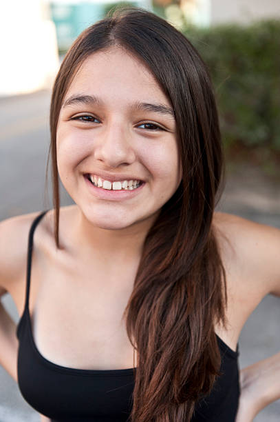 istock Smiling thirteen years old hispanic girl 155139674