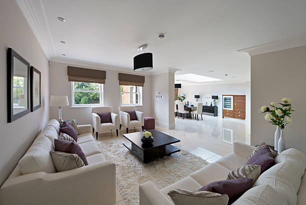 Bright living room with wooden panel trim walls, fireplace and vintage furniture. Northwest, USA