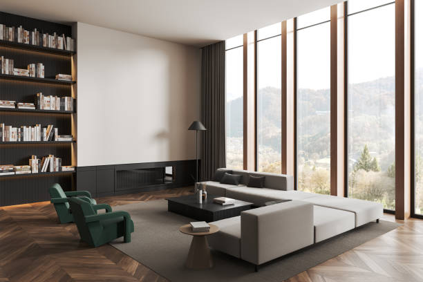 istock Cozy living room interior with couch and shelf with library, window. Mockup wall 1551401272