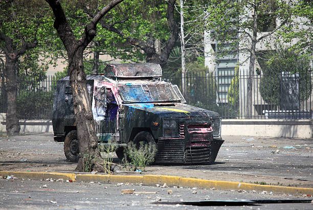 Armored Vehicle Chilean police Armored Vehicle on the street during a student strike in Santiago's Downtown, Chile. police tear gas stock pictures, royalty-free photos & images