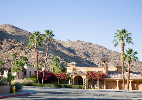 Beautiful Spanish Architecture located against the rocky mountain terrain of the Palm Springs desert. Three car garage.