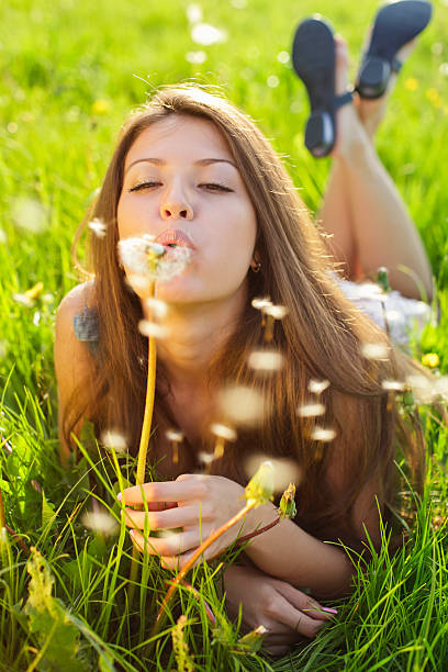 istock Girl with dandelion 155140349