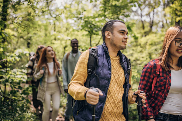 istock Group of friends hiking in nature 1551404926