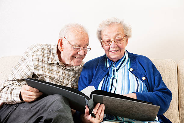 istock senior couple watching photos 155140556