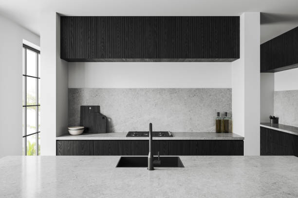 istock White kitchen interior with bar island and cooking area with panoramic window 1551405969
