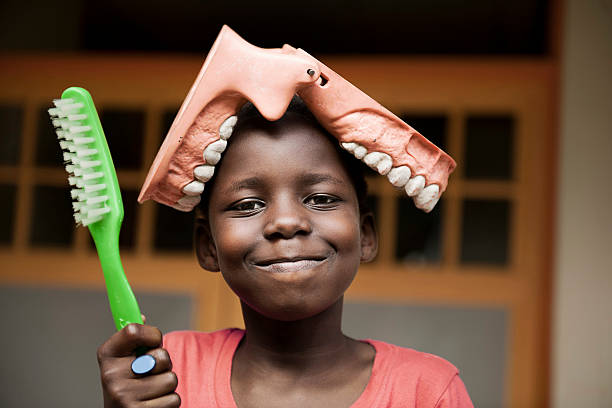 istock African girl with toothbrush and teeth 155140827