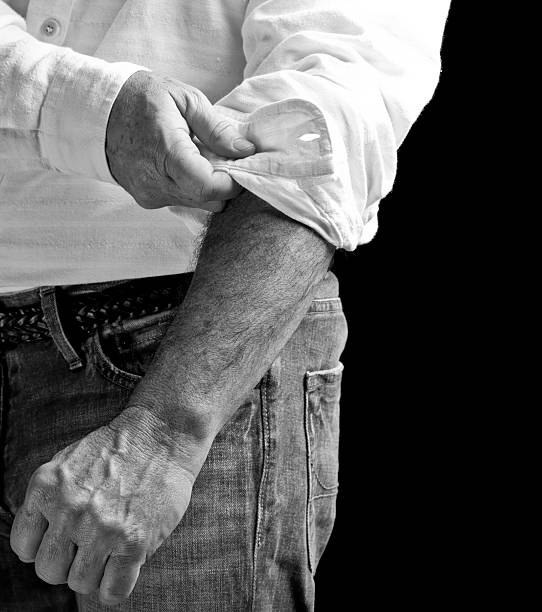 Ready for work Concept for getting to work. Man rolling up sleeve. Click to see more! rolled up sleeves stock pictures, royalty-free photos & images