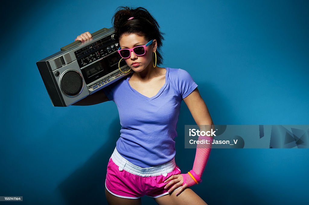 1980's girl with ghetto blaster A 1980's styled woman in neon holding a boom box ghetto blaster.   1980-1989 Stock Photo