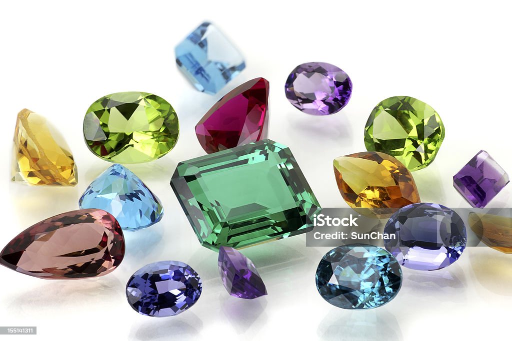 Assorted Gemstones Real Gems Including Sapphire, Amethyst, Emerald, Ruby, Tanzanite, Citrine, Tourmaline, Peridot, Aquamarine, Topaz and Blue Zircon. Jewelry Stock Photo
