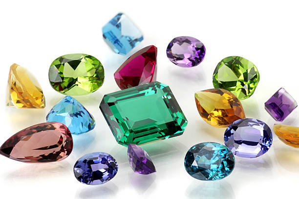 Assorted Gemstones Real Gems Including Sapphire, Amethyst, Emerald, Ruby, Tanzanite, Citrine, Tourmaline, Peridot, Aquamarine, Topaz and Blue Zircon. gemstone stock pictures, royalty-free photos & images