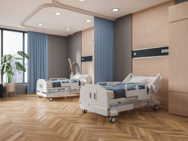 istock Modern hospital room interior with two beds in row, panoramic window 1551413909
